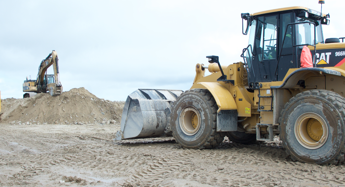TCL Employees working on Heavy Equipment