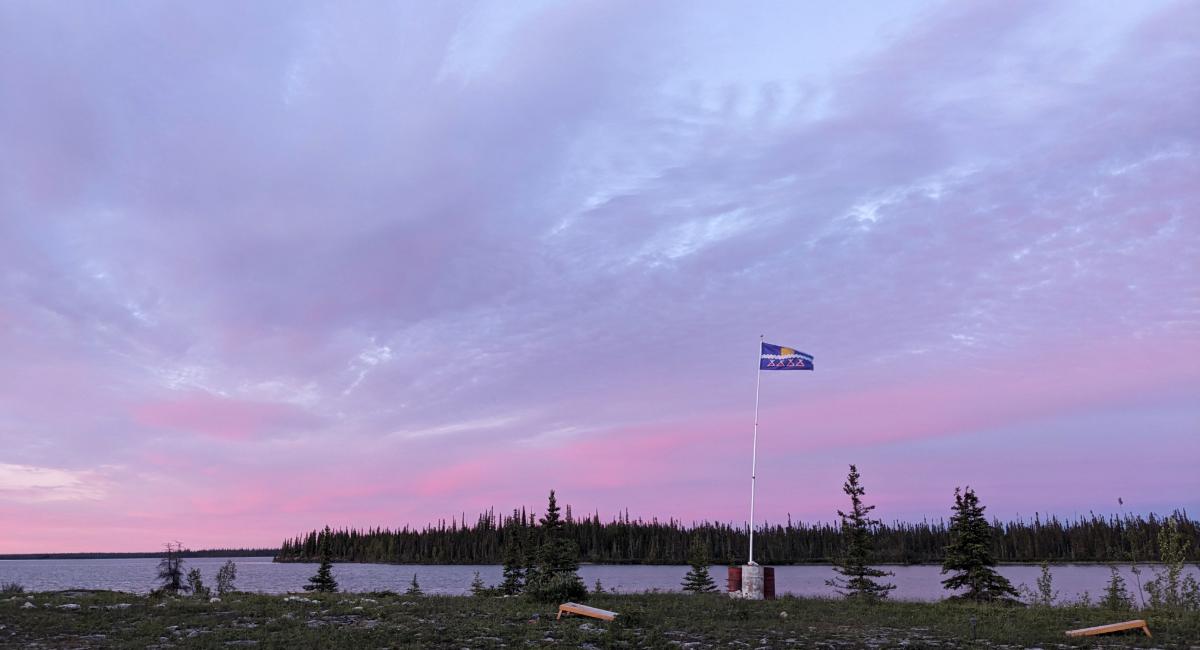 Photo by Samantha Stuart of Tlicho Flag in sunset